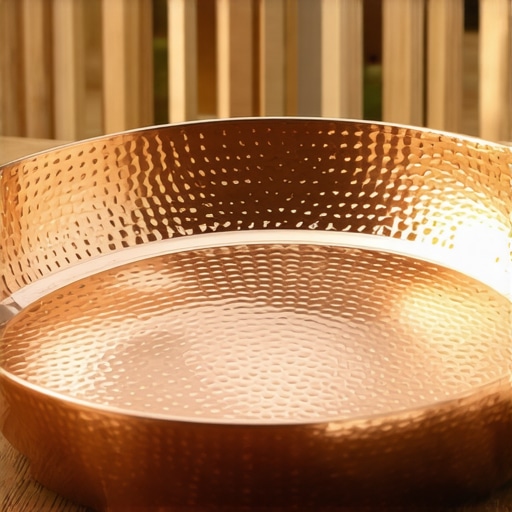 Close-up of a hand-hammered copper paella pan showing its textured surface and tin lining.